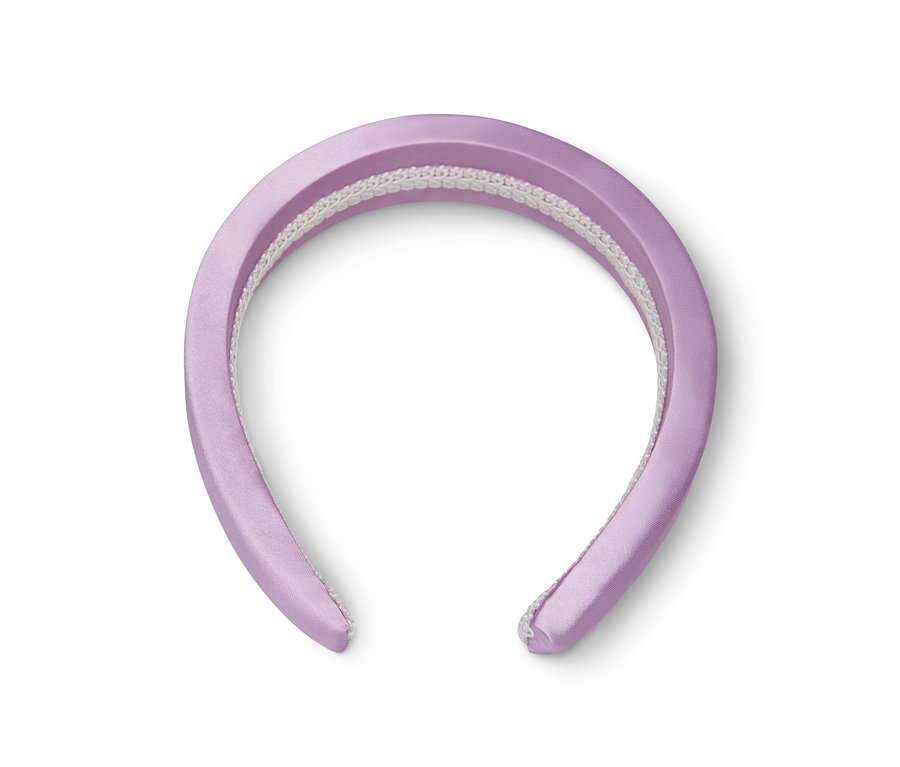 Egy lila hajpánt fehér alapon.