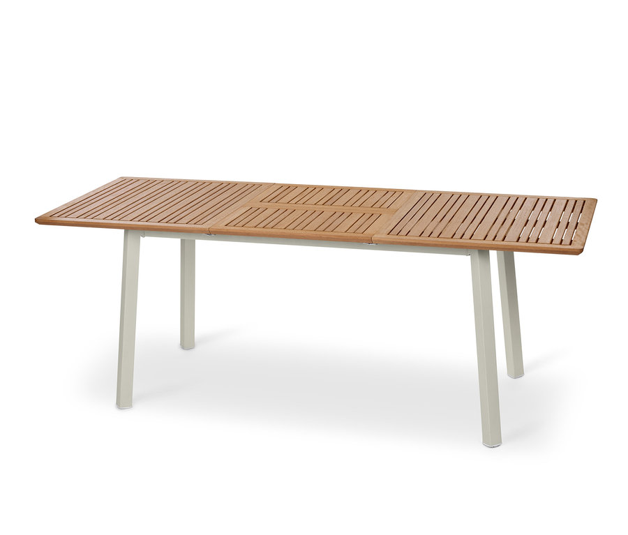 Egy »Liska« kihúzható asztal fa asztallappal és világos lábakkal.