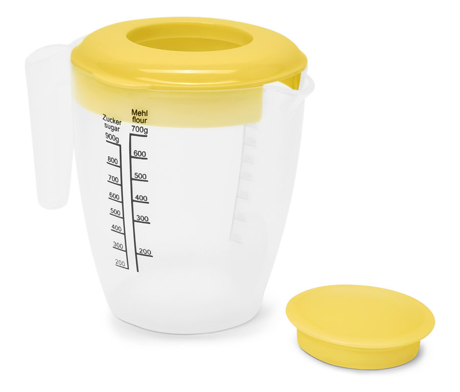 Átlátszó mérőpohár sárga fedővel és mérőskálával.