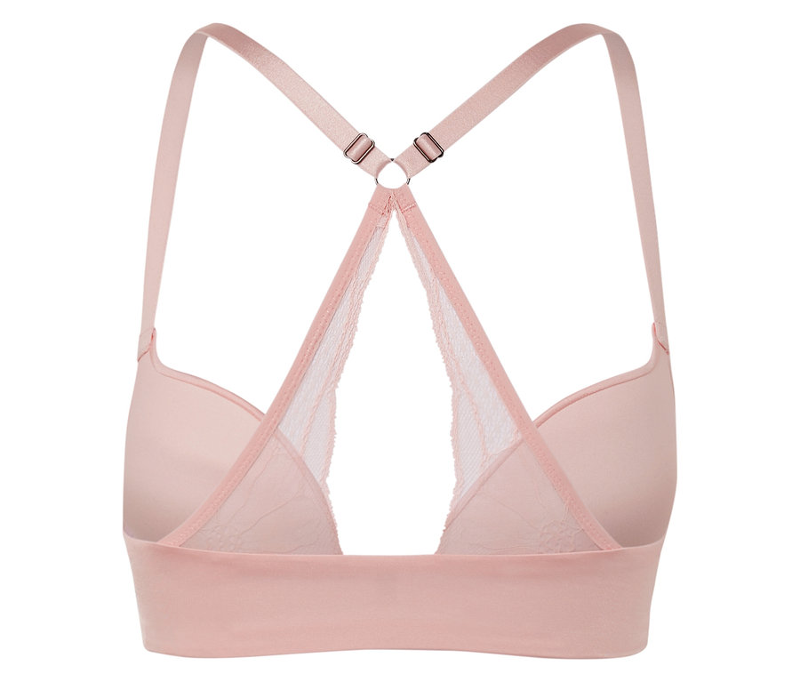 Hátulnézet egy rózsaszín csipkés részletekkel és keresztezett pántokkal ellátott melltartóról.