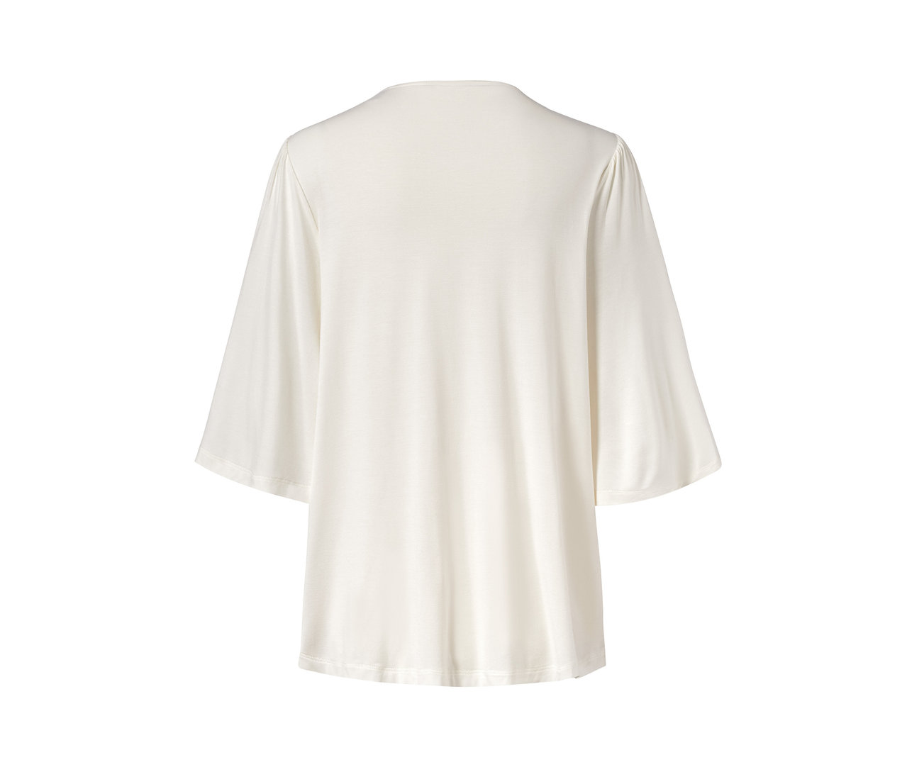 Hátulnézet egy fehér, bő ujjú női felsőről.