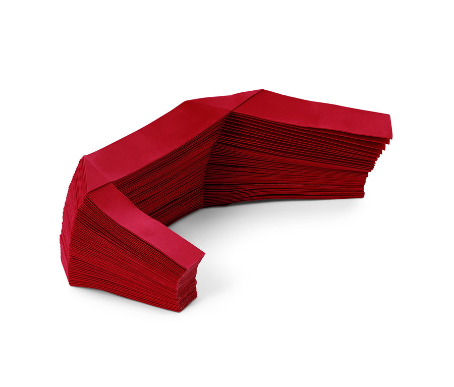 Egy piros papír karácsonyfatalp takaró.