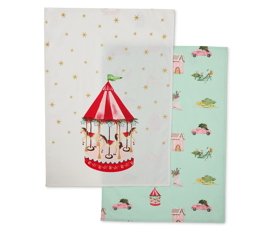 Két anyagból készült konyharuha: az egyik körhintával, a másik téli motívumokkal.