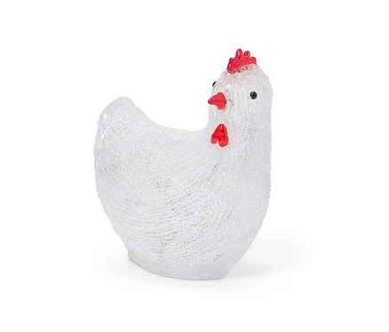 Egy fehér, piros tarajú napelemes LED-es tyúk kültéri használatra, közelről fényképezve.