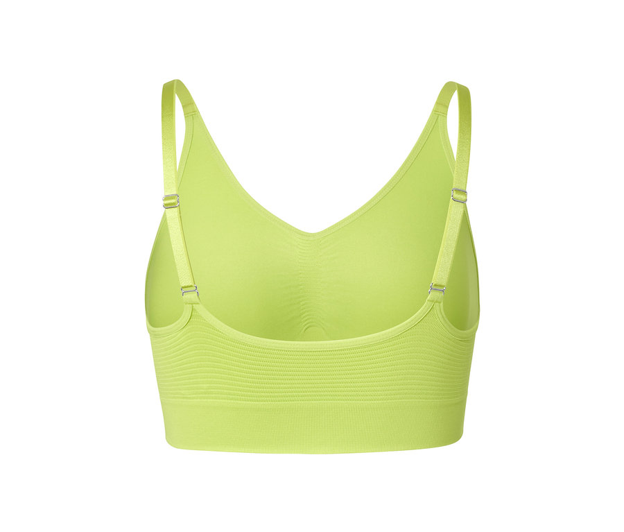 Közelkép egy zöld, varrásmentes bustier sportmelltartó hátulról.