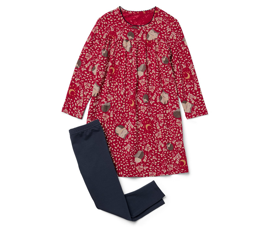 Egy sünis mintájú piros ruha fekszik egy sötétkék leggings mellett.