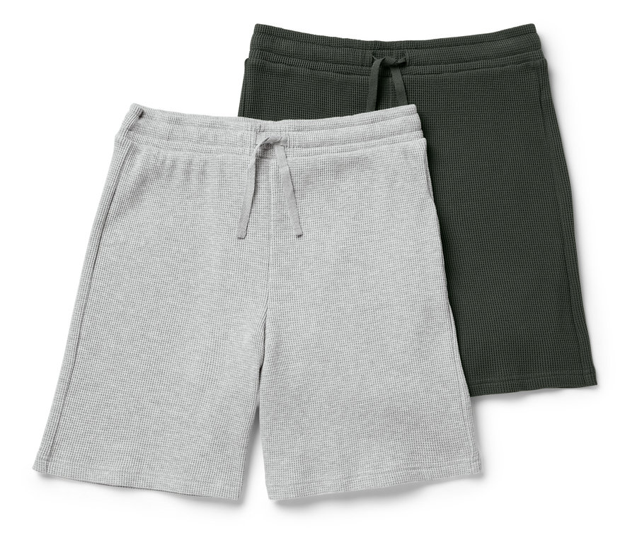 Két waffle rövidnadrág, egy szürke és egy sötétzöld, egymáson fekszenek.