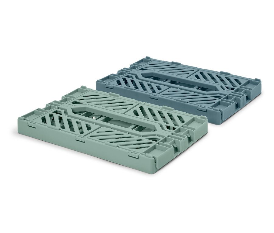 Két összecsukható tárolódoboz, egy világoszöld és egy kék színű, fekszik egy fehér háttéren.