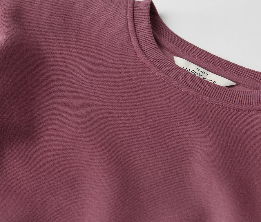 Egy Kinder-Sweatkleid részlete.