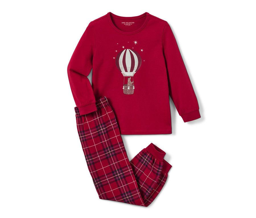 Egy piros Gyerekpizsama, hőlégballon mintával, világít a sötétben. A pizsama elején egy hőlégballon látható.