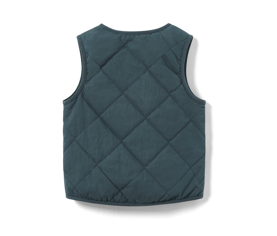 A sötétkék gyerek kifordítható mellény hátulnézete.