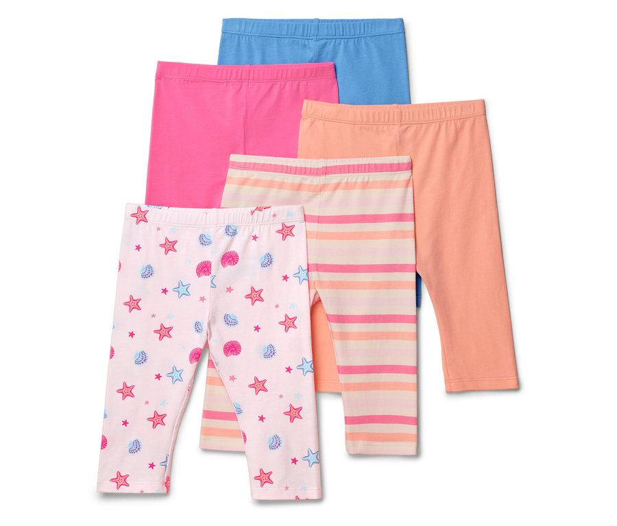 Öt leggings van egymásra helyezve, köztük egy tengeri csillag és kagyló mintás, egy csíkos és három egyszínű: kék, rózsaszín és narancssárga.