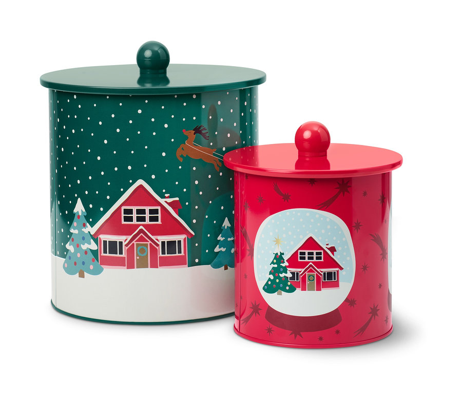 Két karácsonyi kekszesdoboz ház- és fafotívumokkal.