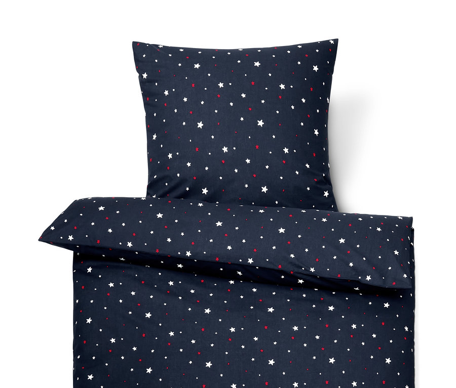 Tengerészkék, csillagmintás prémium pamut ágynemű garnitúra, egyszemélyes méretben, párnára és paplanra.