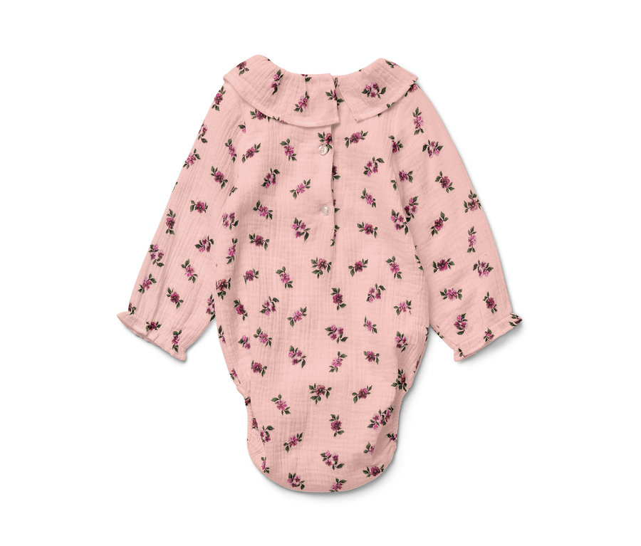 Rózsaszín muszlin body virágmintával.