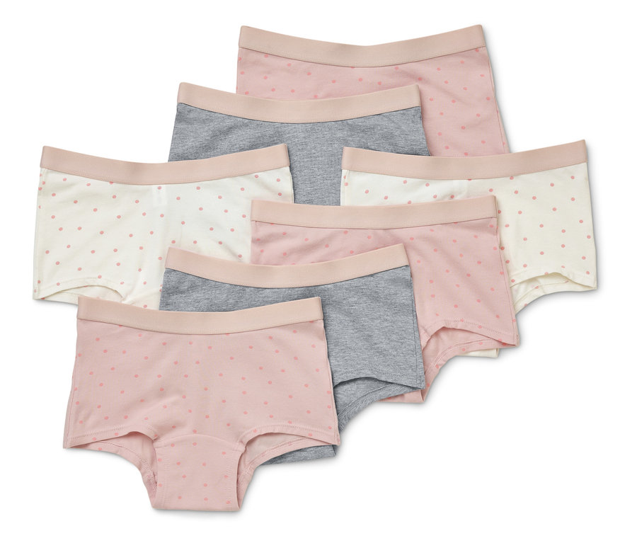 Hét pár rövid női alsónemű rózsaszín, szürke és fehér színben, finom pöttyökkel, egymásra helyezve.
