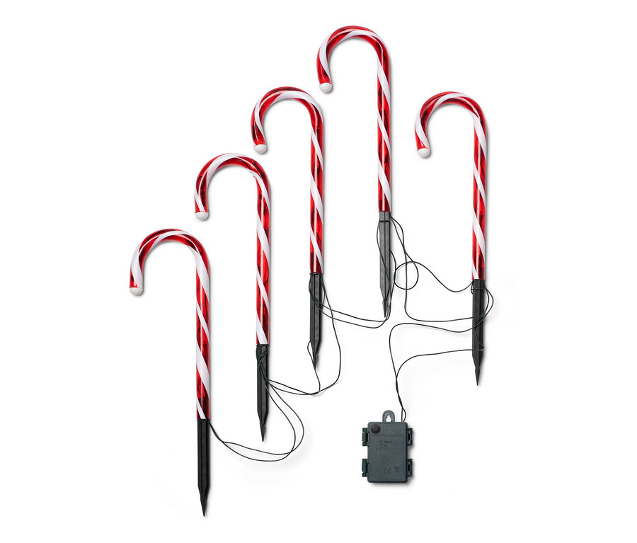 Öt darab LED-es, piros-fehér csíkos, fekete cövekkel ellátott kültéri cukorpálca.