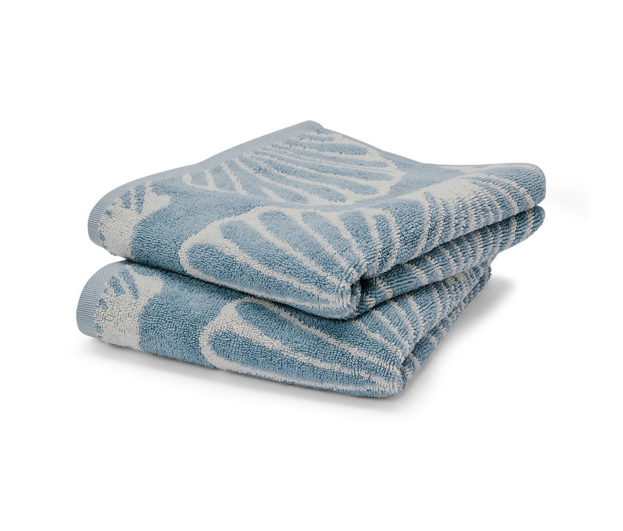 Két kék kagylós jacquard törölköző egymásra hajtva.