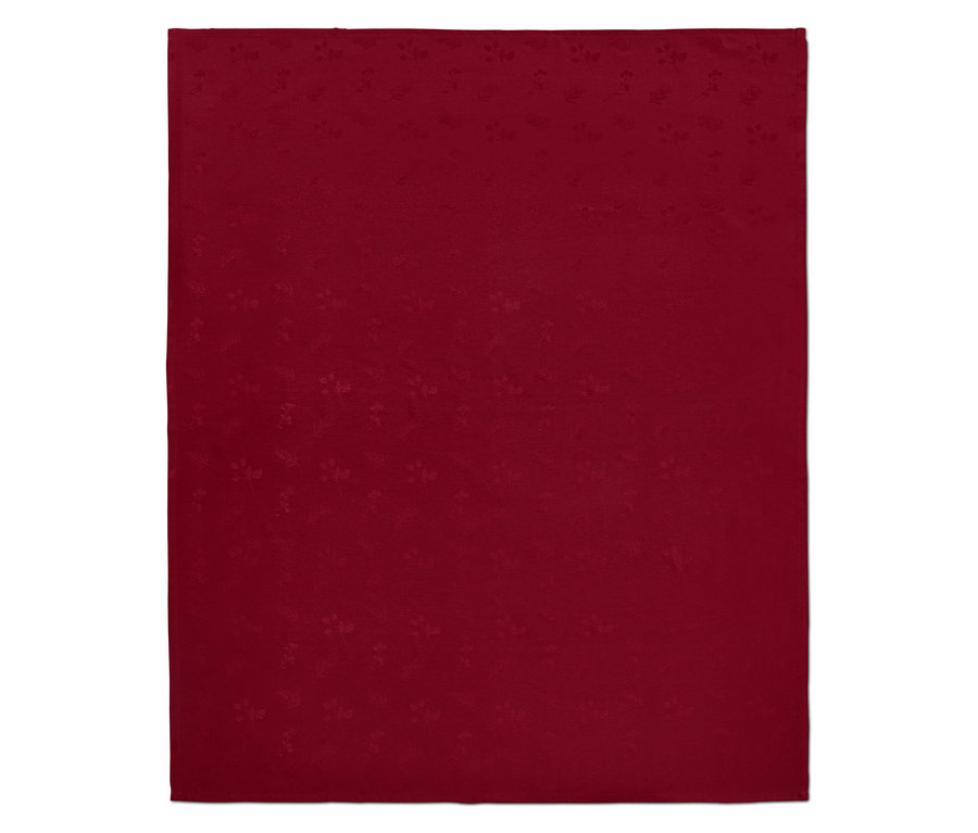 Egy piros jacquard asztalterítő.