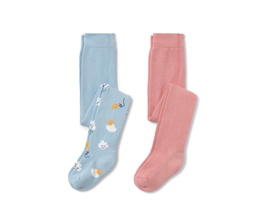 Két kisgyermek harisnyanadrág: egy világoskék felhő-, nap- és sárkánymintával, a másik rózsaszín.