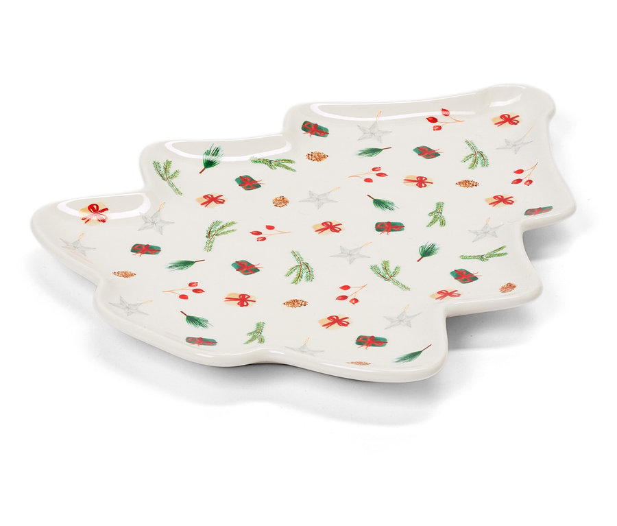 Fehér, karácsonyfa alakú tányér karácsonyi motívumokkal.