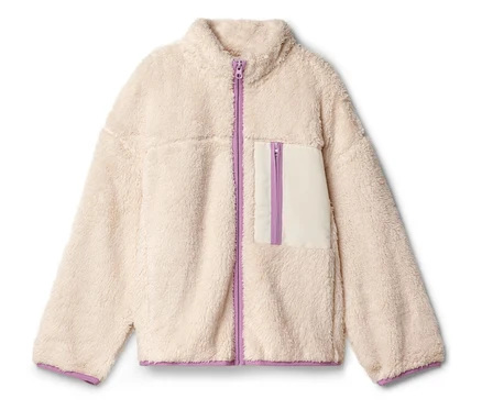 Krémszínű fleece pulóver lila cipzárral és lila díszítéssel az alján.