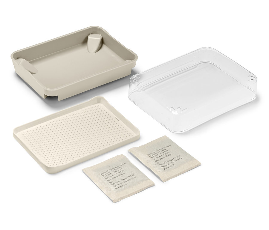 Egy csíráztató készlet magokkal, szétszórva, két csomag maggal.