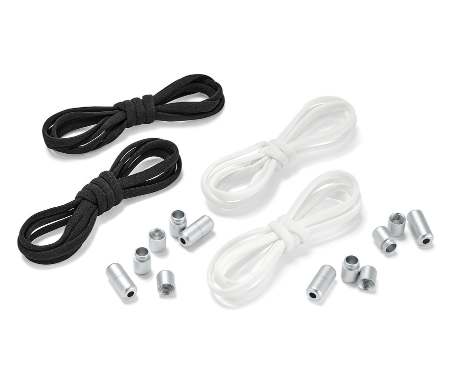 Két pár elasztikus cipőfűző, egy fekete és egy fehér pár, egymás mellett fekszik fém végekkel.