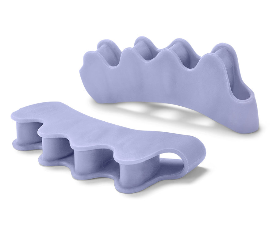 Két lila lábujj-szétválasztó fehér háttérrel.