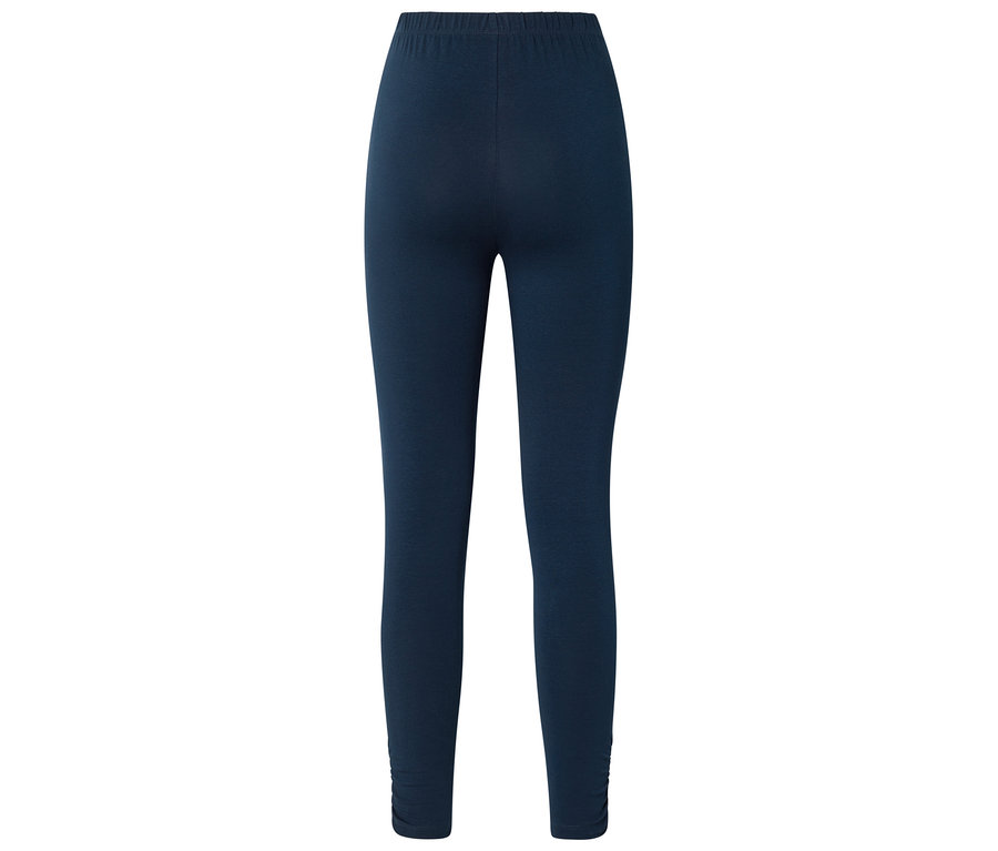 Sötétkék leggings gumis derékpánttal és ráncolt szárvégekkel, hátulról fényképezve.