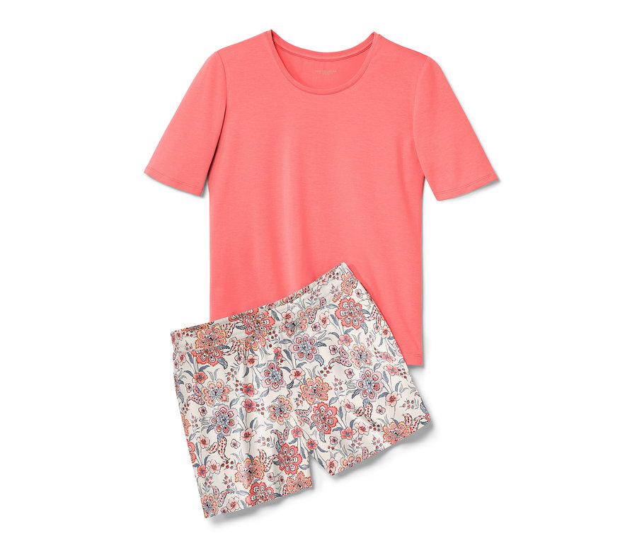 Egy rövid, virágos/papaya színű női pizsama, egy pólóból és egy rövidnadrágból áll.