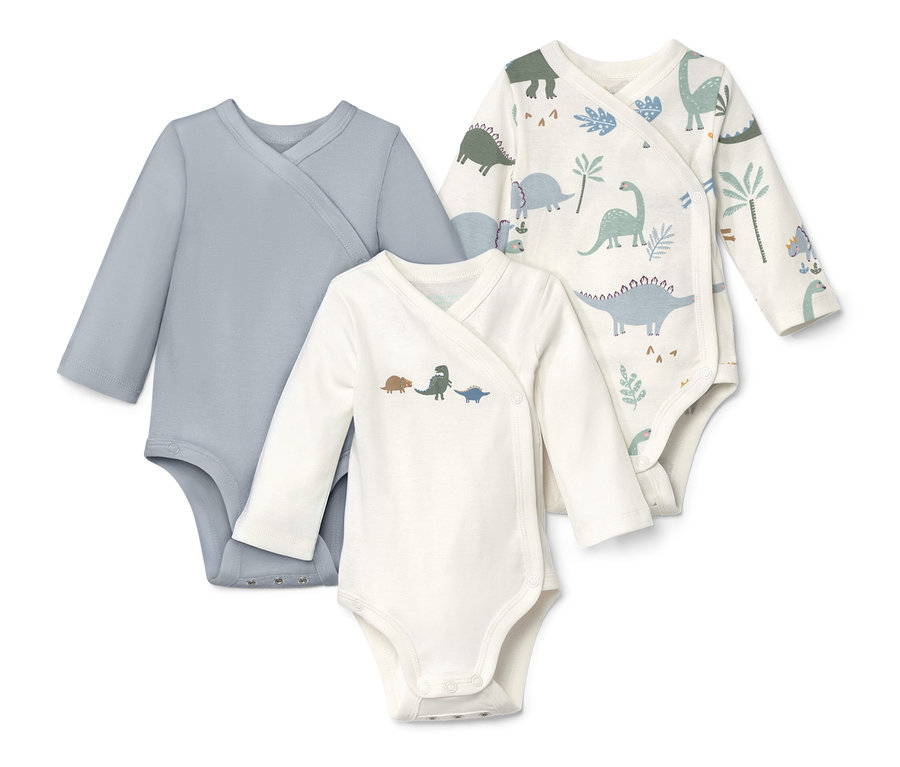 Három hosszú ujjú body: egy kék, egy dinó mintás, egy dinoszaurusz és növény mintás.