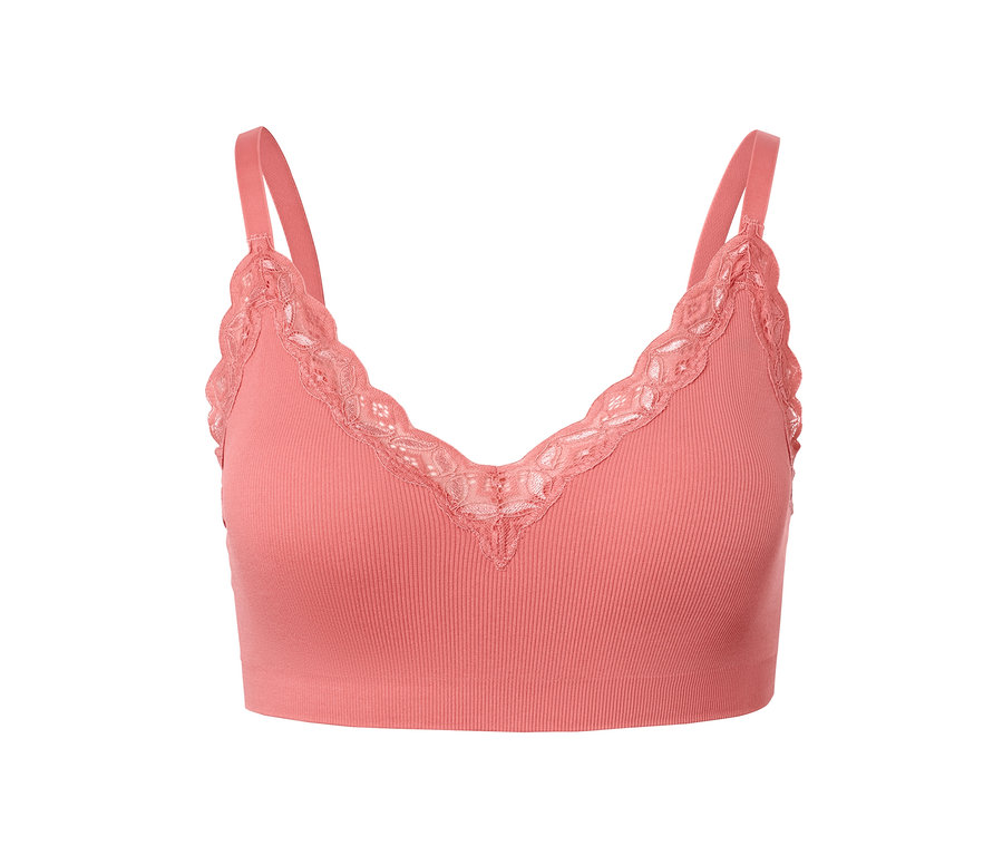 Egy korall színű női seamless bustier melltartó részlete.