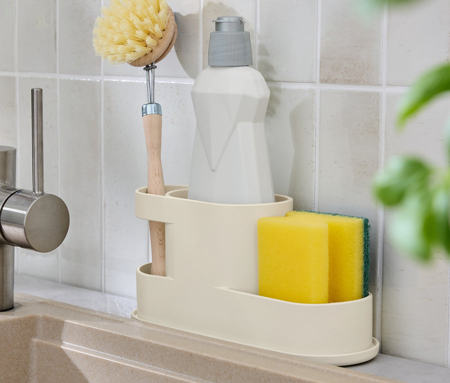 Mosogatótál tartóval keféhez, szivacshoz és mosogatószerhez.