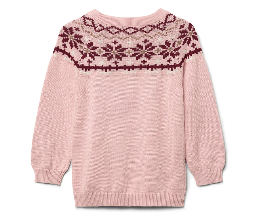 Rózsaszín pulóver karácsonyi mintával a felső részén.