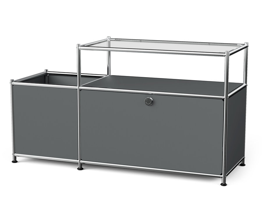 Szürke »CN3« fém alacsony szekrény lenyíló ajtóval és üveglappal.