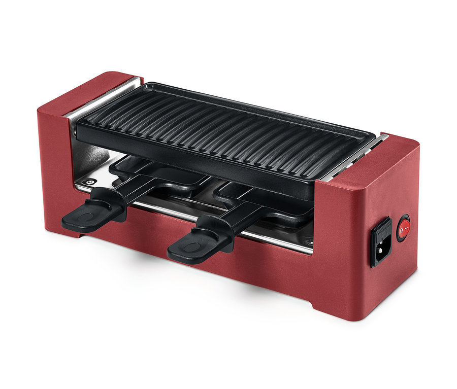 Piros raclette grill 2 személy részére, tapadásmentes bevonattal és két serpenyővel.