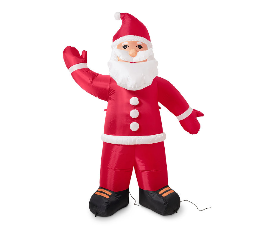 Egy XXL-es LED-es felfújható télapó áll és integet.