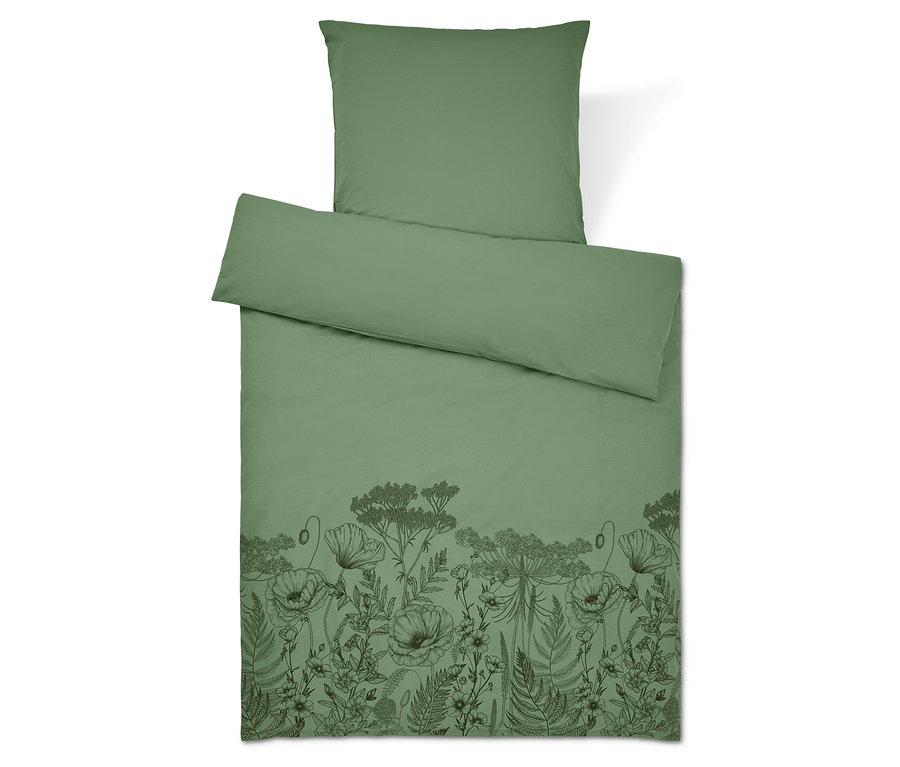 Zöld ágynemű virágmintával. Párna felül.