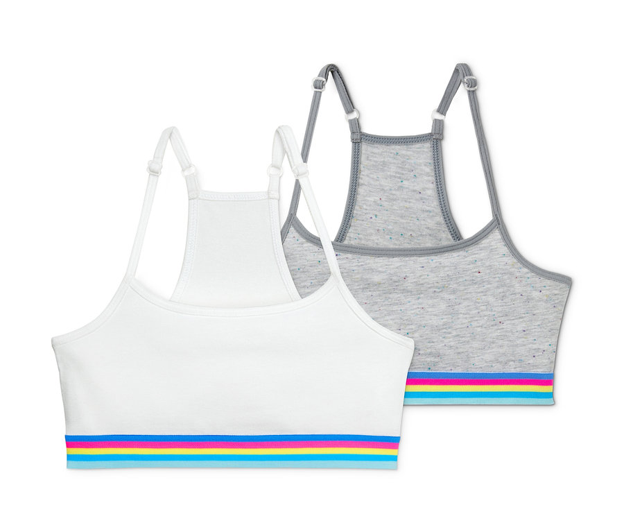 Két lányka bustier melltartó szettben, egy fehér és egy szürke, mindkettő színes csíkokkal.
