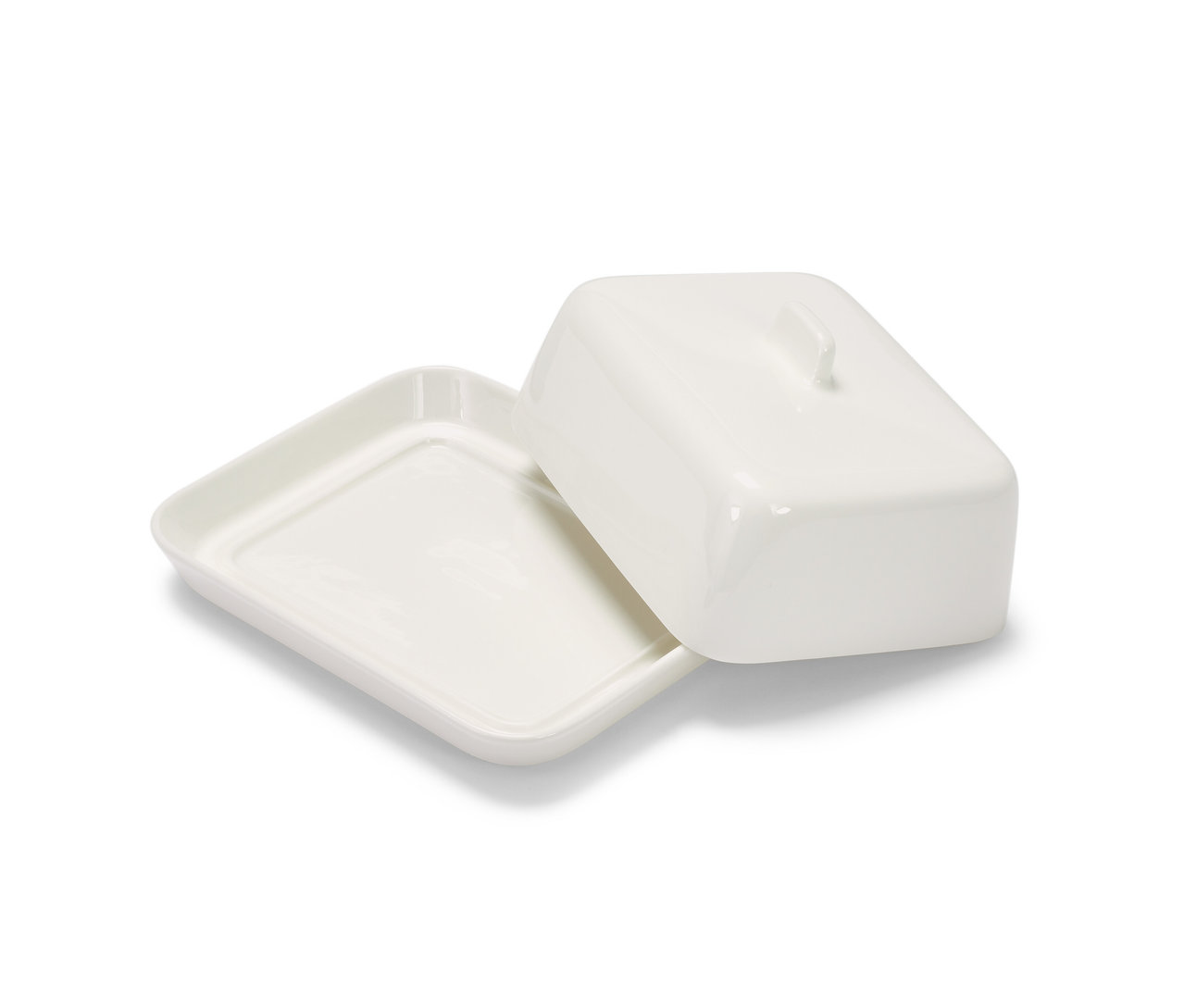 Fehér porcelán vajtartó tetővel.