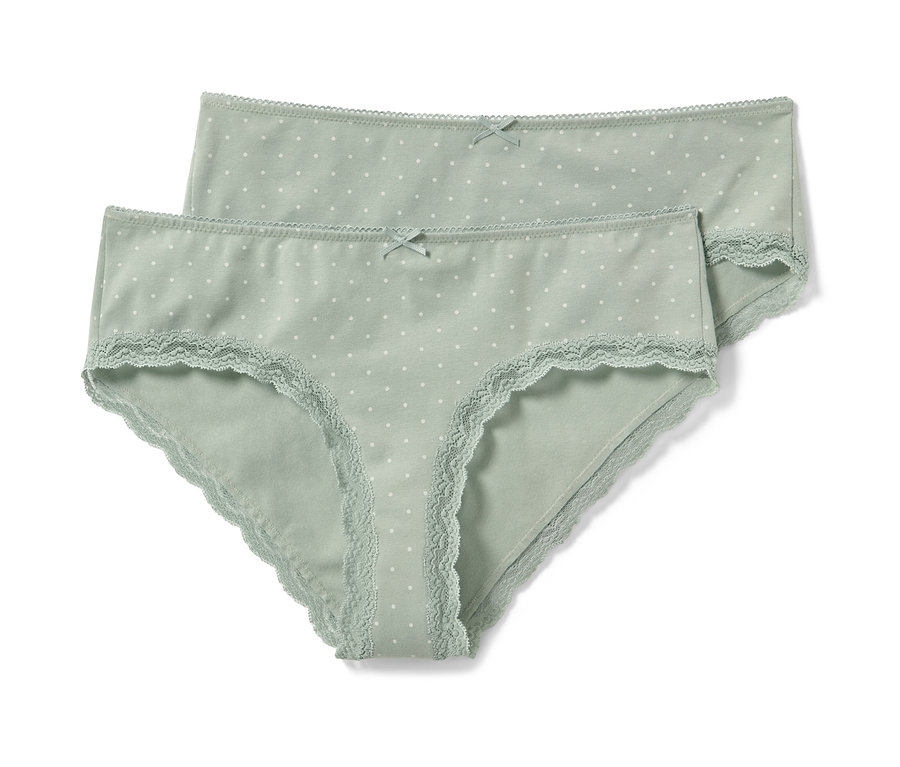 Két világoszöld, fehér pöttyös női hipster alsó.