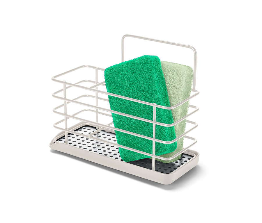 Egy zöld és egy világoszöld szivacs egy fém mosogatóeszköz-tartóban.