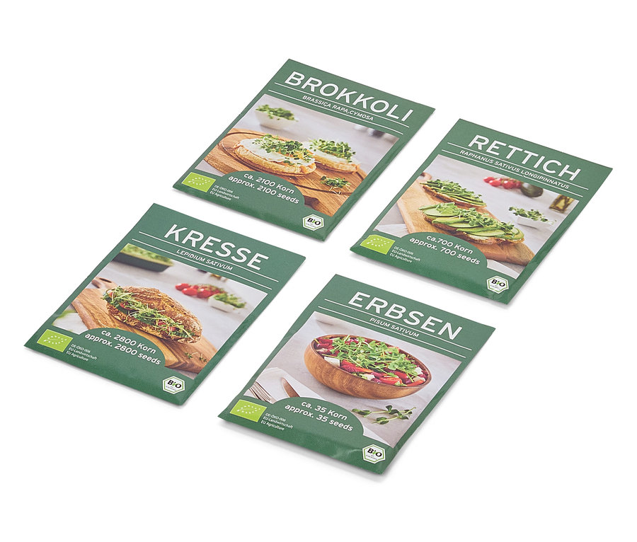 Négy zöld magtasak átlósan helyezkedik el egy fehér háttéren. A tasakokon brokkoli, zsázsa, retek és borsó képei láthatók.