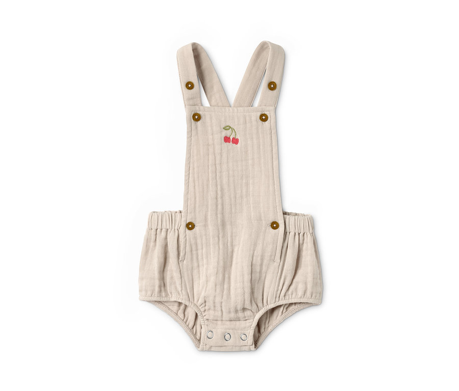 Bézs színű kisgyerek napozó cseresznye hímzéssel és gombokkal.