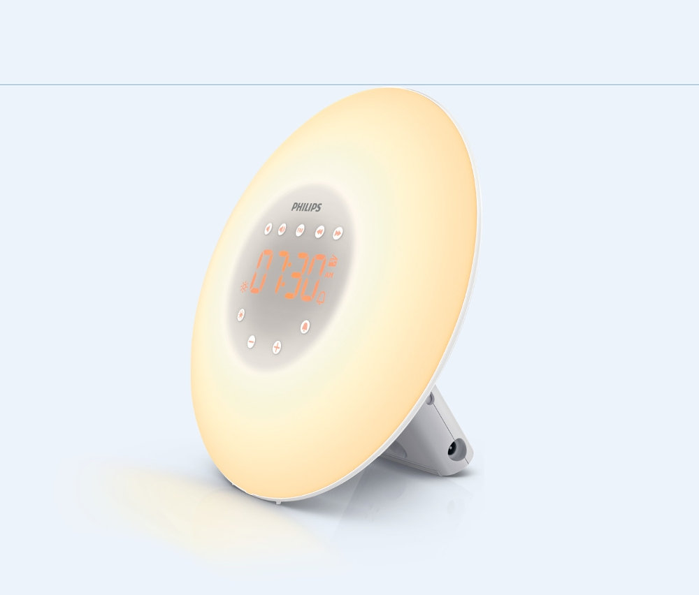 Philips Wake up Light ébresztőóra világos háttérrel. A kerek kijelzőn 07:30-as idő látható.