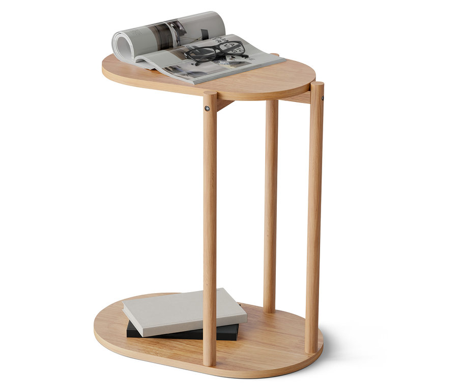 Egy faasztal tetején egy kinyitott magazin és egy feltekert újság található. Az asztal alján két könyv van.