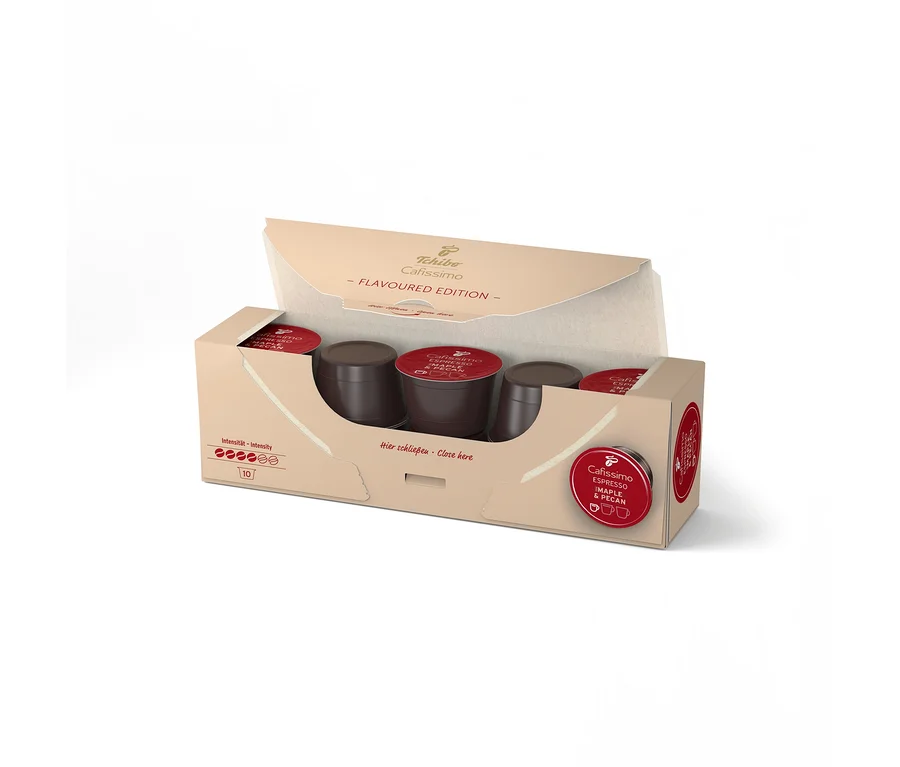 Nyitott Tchibo Cafissimo Flavoured Espresso Maple & Pecan doboz, 10 sötétbarna, piros tetejű kapszulával.