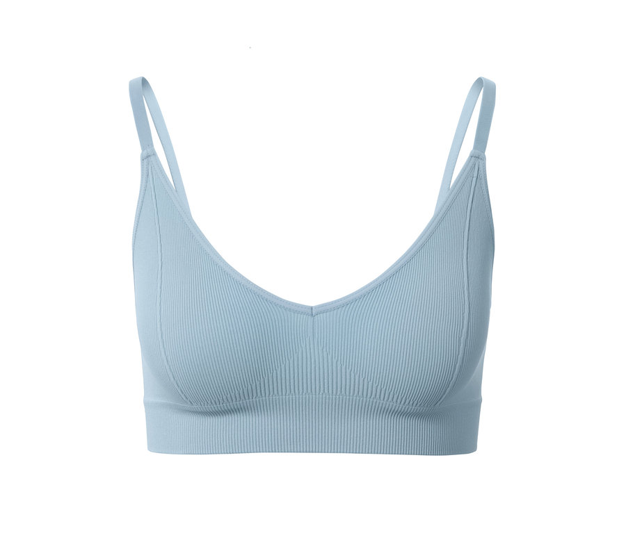 Világoskék női seamless bustier melltartó részlete.