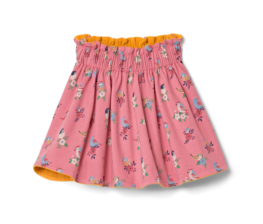 Rózsaszín kislány kifordítható szoknya, madár és virág mintával.